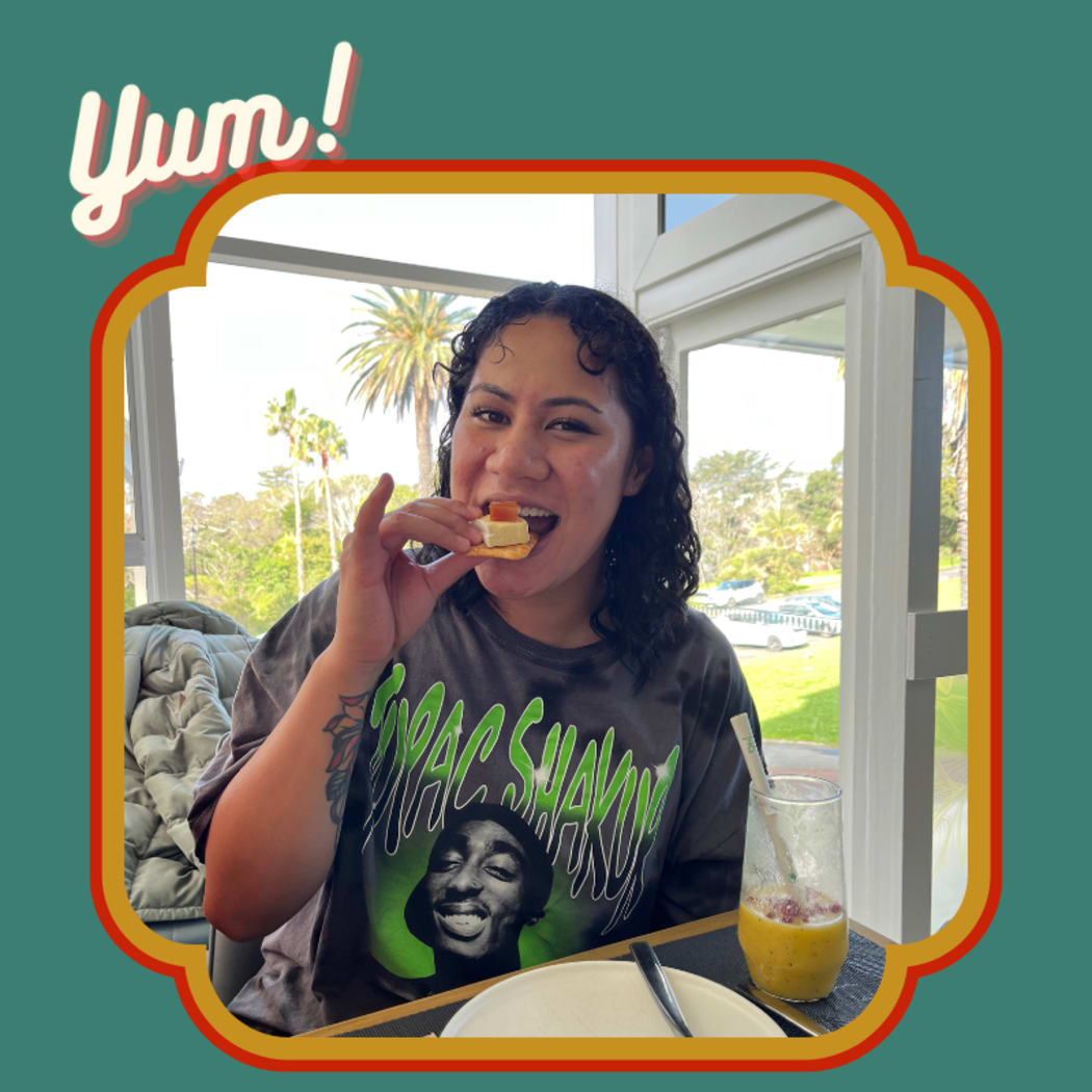 A photo of the actor and comedian, Sieni Leo’o Olo, also known as Bubbah. She is eating a cracker and cheese with her little finger pointing upwards. The image is framed by 70s colouring and captioned "Yum!"