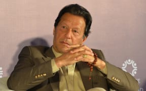 Pakistan's Prime Minister Imran Khan attends the Refugee Summit Islamabad to mark 40 years of hosting Afghan refugee in Islamabad on February 17, 2020. (Photo by Aamir QURESHI / AFP)