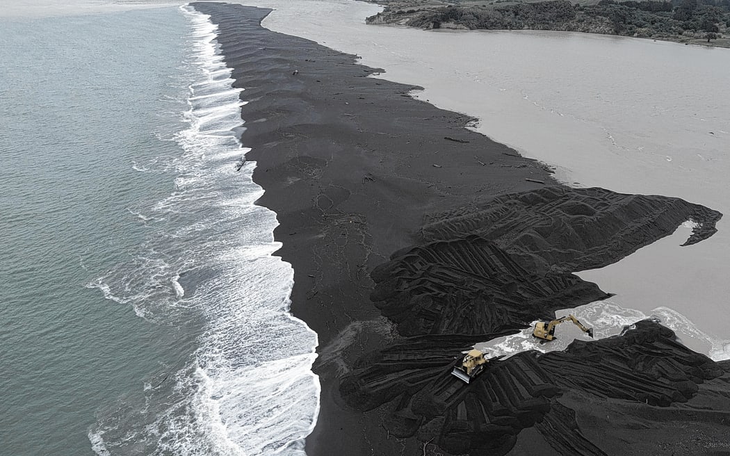 Hamish Pryde and a worker from Pryde Contracting were busy opening up the Wairoa River mouth last month in an effort to avert a flooding disaster for the township and low-lying areas.