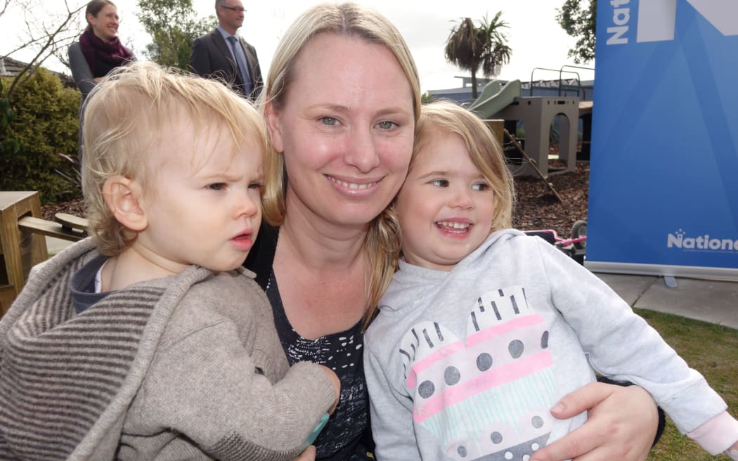 Nelson mother Carmel Layton with her two children, Ayla, 3, and Elsie, 16 months, at today’s announcement in Richmond.