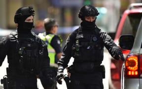Australian SWAT police are seen on Bourke Street after a car ploughed into pedestrians in the centre of Melbourne on 20 January, 2017.