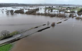 In an aerial view, water floods a road and field on January 09, 2023 in Santa Rosa, California. The San Francisco Bay Area and much of Northern California continues to get drenched by powerful atmospheric river events that have brought high winds and flooding rains. The storms have toppled trees, flooded roads and cut power to tens of thousands. Storms are lined up over the Pacific Ocean and are expected to bring more rain and wind through the end of the week.