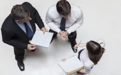 Executives in meeting, overhead view