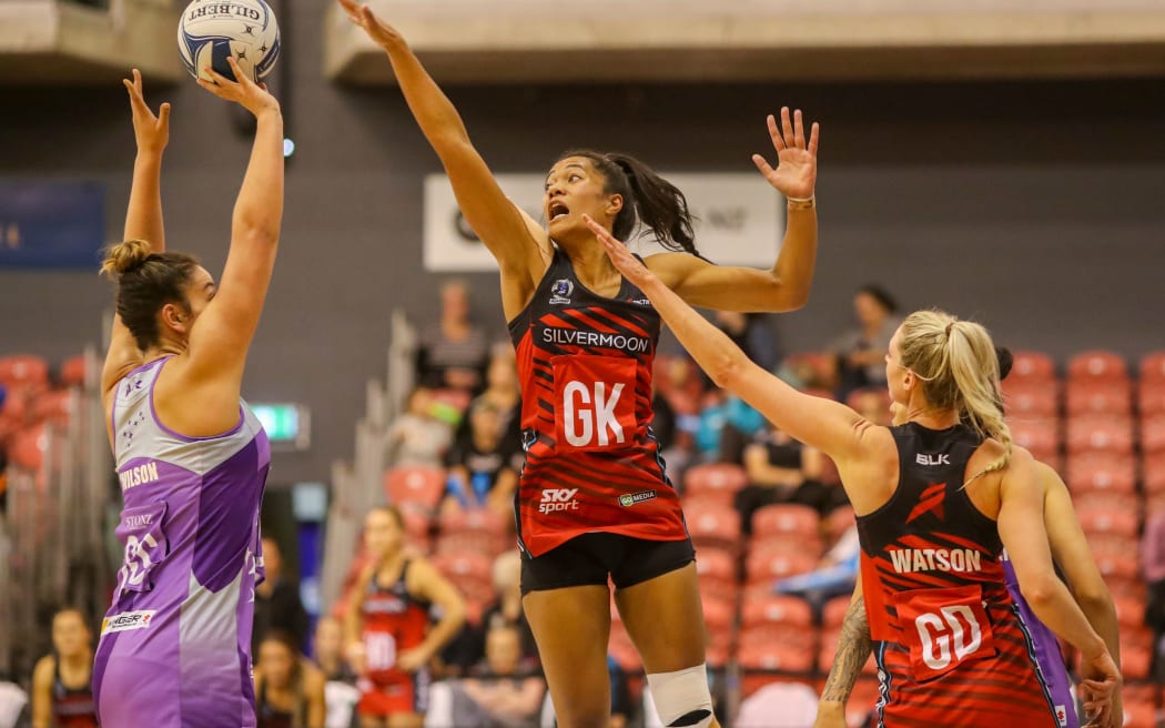 Mainland Tactix goalkeep Temalisi Fakahokotau defending Northern Stars shooter Maia Wilson