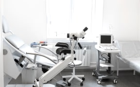 Gynecological chair, colposcope and ultrasound machine.