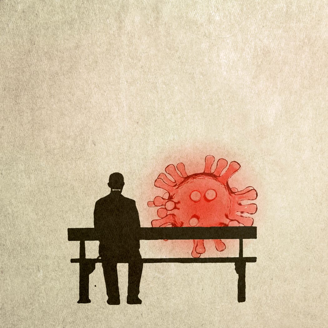 Man sitting on a bench next to Covid particle, illustration. (Photo by FANATIC STUDIO / SCIENCE PHOTO L / FST / Science Photo Library via AFP)