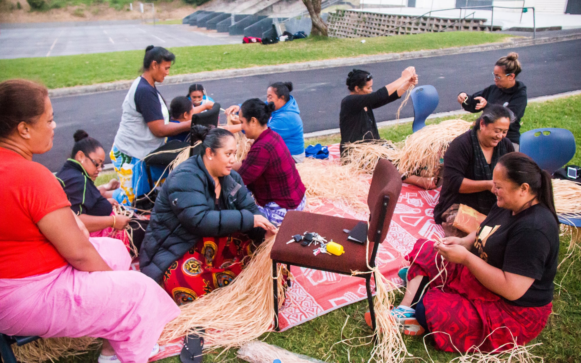 Mothers of the St Paul's College students hang out together while they make their son's Polyfest uniforms.