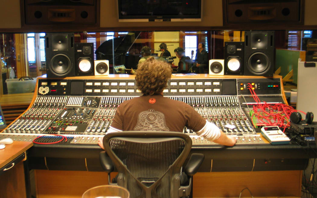 This is a photo taken over the engineers shoulder as Crowded House perform on NZ Live.
