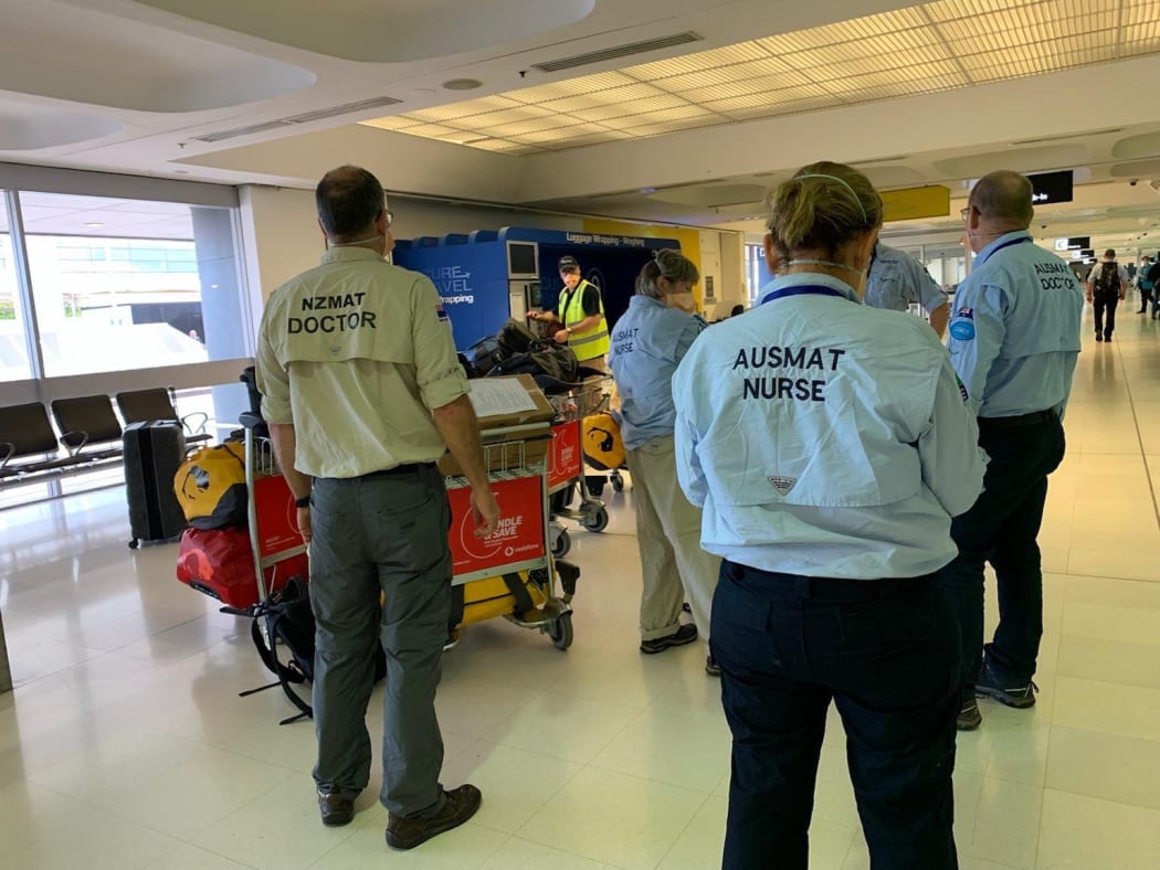 Members of the AUSMAT team arrive in Fiji.