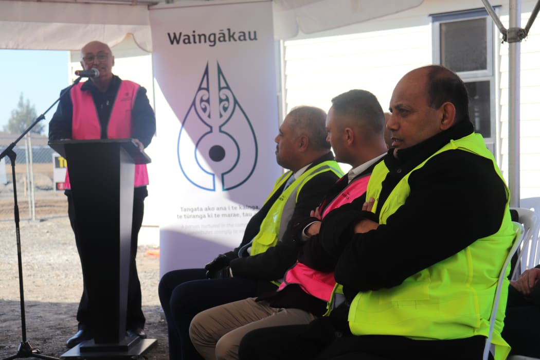 Te Taiwhenua o Heretaunga chairman Mike Paku speaks by the Waingākau development, with MPs (from back) Peeni Henare, Shanan Halbert and Willie Jackson.