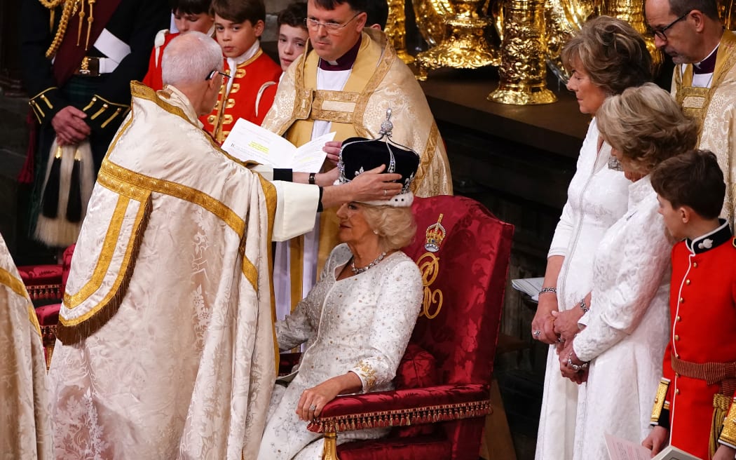 The Archbishop of Canterbury Justin Welby places a modified version of Queen Mary's Crown onto the head of Britain's Camilla, Queen Consort during the Coronation Ceremony inside Westminster Abbey in central London, on May 6, 2023, she will be known as Queen Camilla after the ceremony. - The set-piece coronation is the first in Britain in 70 years, and only the second in history to be televised. Charles will be the 40th reigning monarch to be crowned at the central London church since King William I in 1066. Outside the UK, he is also king of 14 other Commonwealth countries, including Australia, Canada and New Zealand. (Photo by Yui Mok / POOL / AFP)