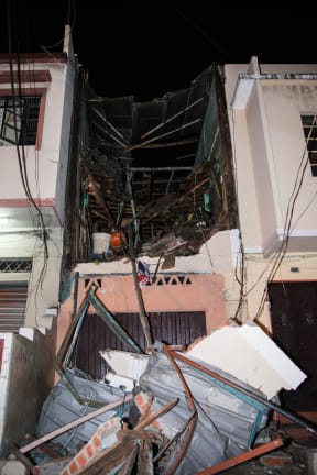 A collapsed building in Ecuador following a 7.8 magnitude earthquake.