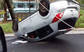 Car in Saipan left upside down by Typhoon Soudelor