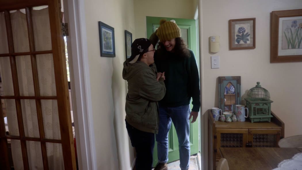 Jesse Coles-Hart greets his friend Benny with enthusiasm.