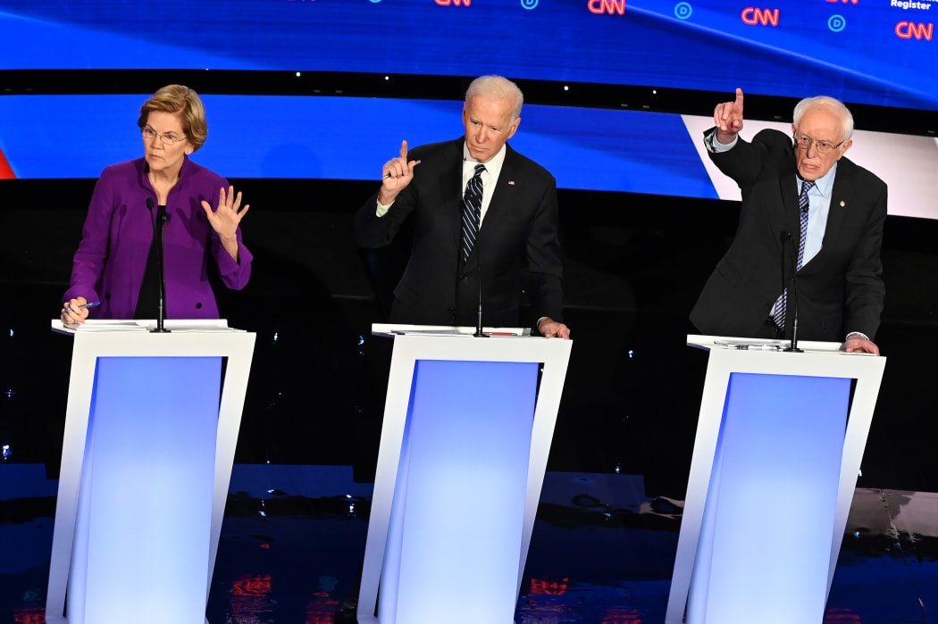 Democratic presidential hopefuls Massachusetts Senator Elizabeth Warren (L), former Vice President Joe Biden (C) and Vermont Senator Bernie Sanders participate of the seventh Democratic primary debate of the 2020 presidential campaign season.