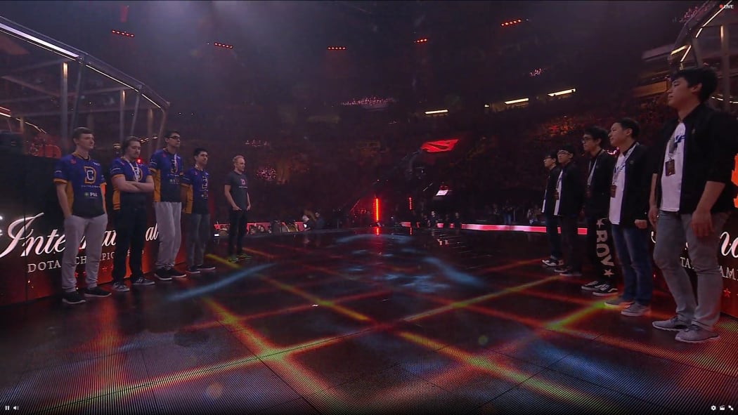 The players from Digital Chaos and Wings face each other before entering the soundproof booths.