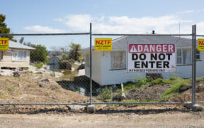 Houses on College Rd are still fenced off and uninhabitable