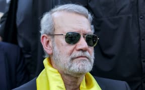 (FILES) Iran's security chief Ali Larijani attends a ceremony by the Lebanese Shiite movement Hezbollah marking the first anniversary of Israel's assassination of their longtime leader Hassan Nasrallah, in Beirut's southern suburbs on September 27, 2025. Israeli Defence Minister Israel Katz said on March 17, 2026, that Iran's powerful national security chief Ali Larijani was "eliminated last night", along with the commander of Tehran's Basij paramilitary force. (Photo by Anwar AMRO / AFP)