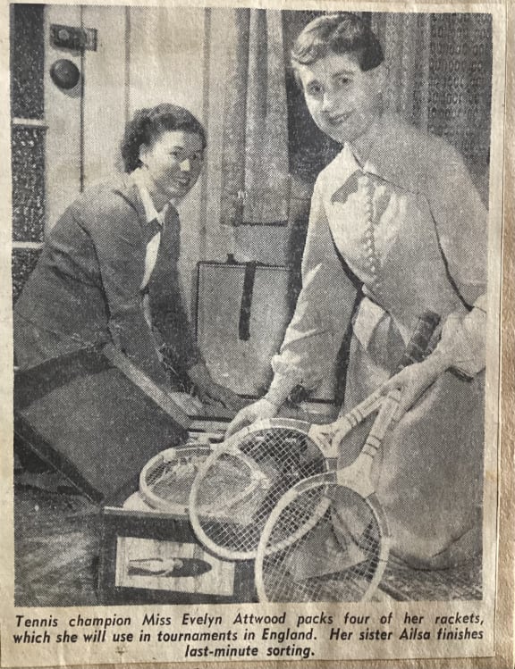 An article at the time showing Evelyn Attwood (right) with her sister, packing for her trip to England.