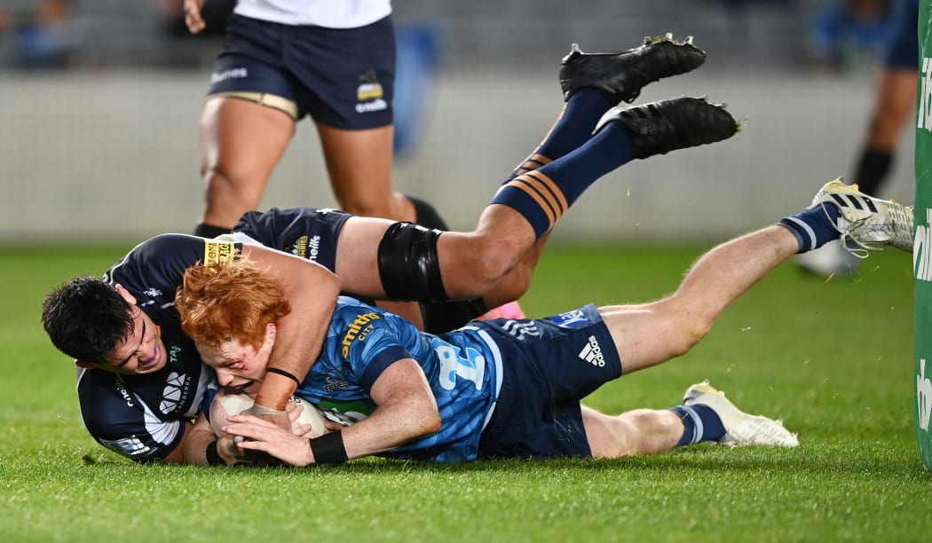 Blues halfback Finlay Christie scores against the Brumbies right on halftime