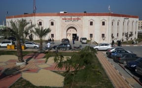 Palestinians stand outside the Indonesian Hospital in Beit Lahia in the northern Gaza Strip on January 13, 2016. The Indonesian Hospital, which is the first new hospital in a decade in the Palestinian enclave, was funded by an Indonesian NGO and opened its doors at the end of 2015.
The 50-day war in July-August 2014, which killed 73 Israelis and some 2,200 Palestinians, destroyed or severely damaged more than 20,000 Palestinian homes, 148 schools, 15 hospitals and 45 primary healthcare centres. (Photo by MOHAMMED ABED / AFP)