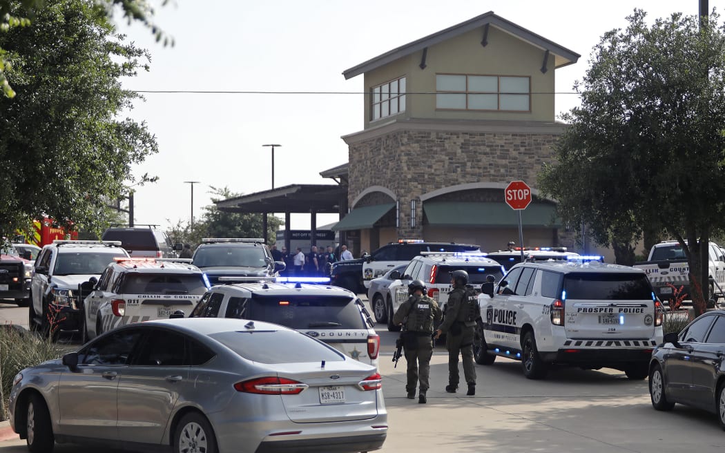 ALLEN, TEXAS - MAY 6: Emergency personnel work the scene of a shooting at Allen Premium Outlets on May 6, 2023 in Allen, Texas. According to reports, a shooter opened fire at the outlet mall, injuring nine people who were taken to local hospitals. The police have confirmed there were fatalities but have not specified how many. The unidentified shooter was neutralized by an Allen Police officer responding to an unrelated call.   Stewart F. House/Getty Images/AFP (Photo by Stewart F. House / GETTY IMAGES NORTH AMERICA / Getty Images via AFP)
