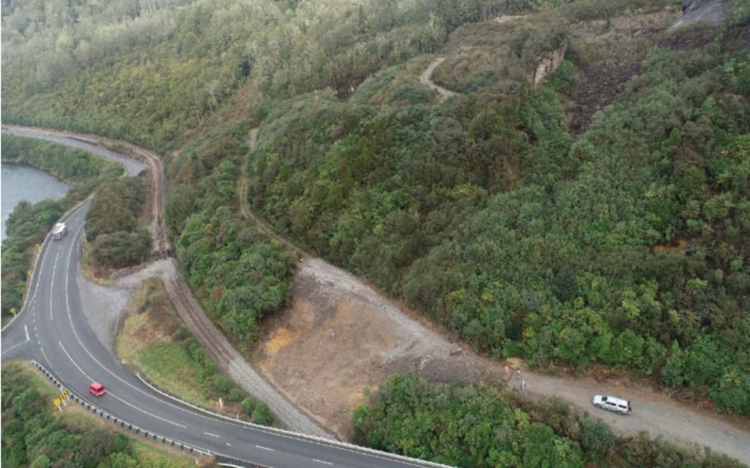 An aerial view of the cleared slip marked in yellow below the Kiwi quarry access road. The slip came down on to the Greymouth-Stillwater railway on June 13, and the Tranz Alpine passenger train ran into the slip near the rail overbridge, bottom. The quarry is owned by the West Coast Regional Council and the access road by the Grey District Council. The quarry has been closed for several years.