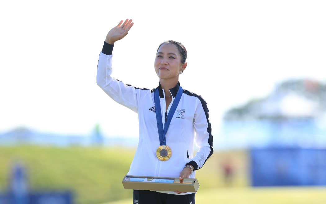 Lydia Ko (NZL) stands on the podium with her Gold medal after winning the Women's Individual Stroke Play Golf at Paris 2024.