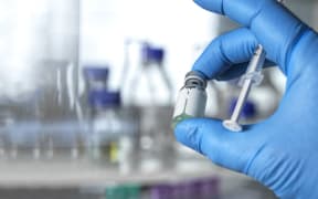 Doctor preparing a drug or vaccine in the clinic.