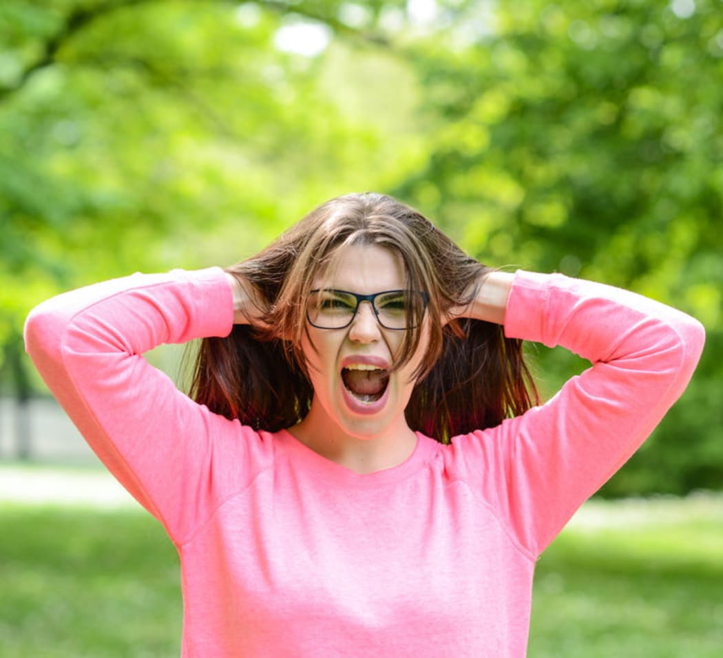 Girl screaming (stock photo).