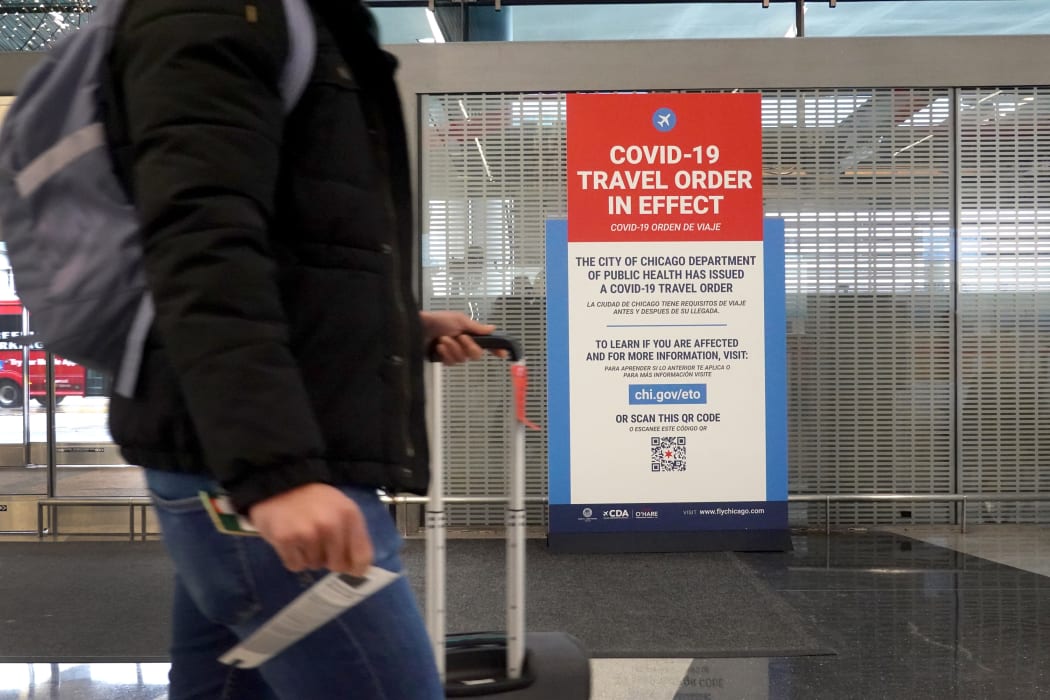 A traveller passes through O'Hare International Airport in Chicago, Illinois, in November 2020.