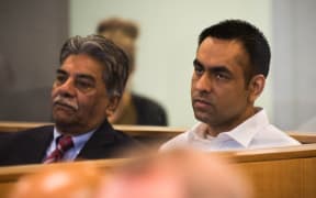 Gurjinder Singh (right) sitting in the dock at Auckland High Court with a translator (left).