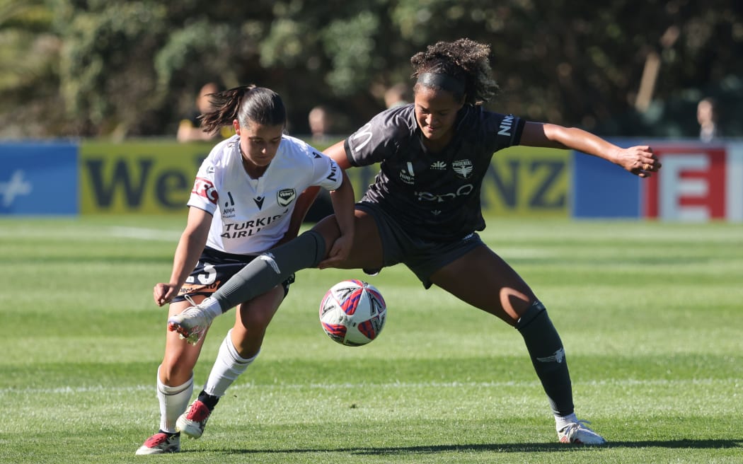 Phoenix Maya Mccutcheon with Melbourne's Rachel Lowe during the A-League Women.