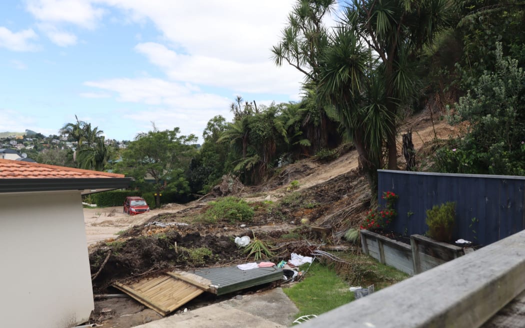 Debris behind one of the homes after the slip. Photo: SunLive.