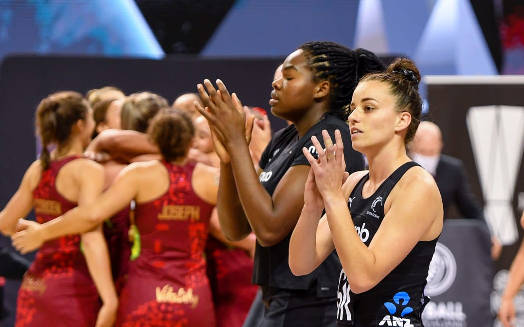 Dejected Georgia Tong (r) and Grace Nweke of the Silver Ferns after losing third test to England, 2021.