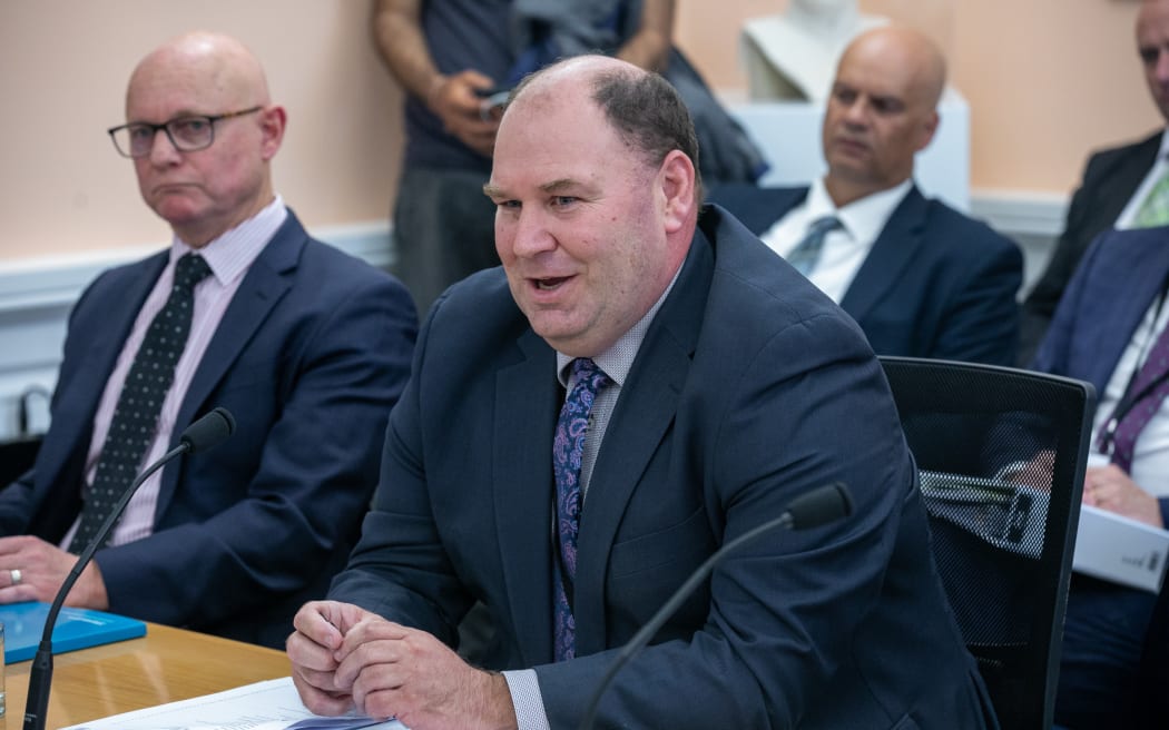 Andrew Hoggard answers questions during a scrutiny week hearing on MPI.