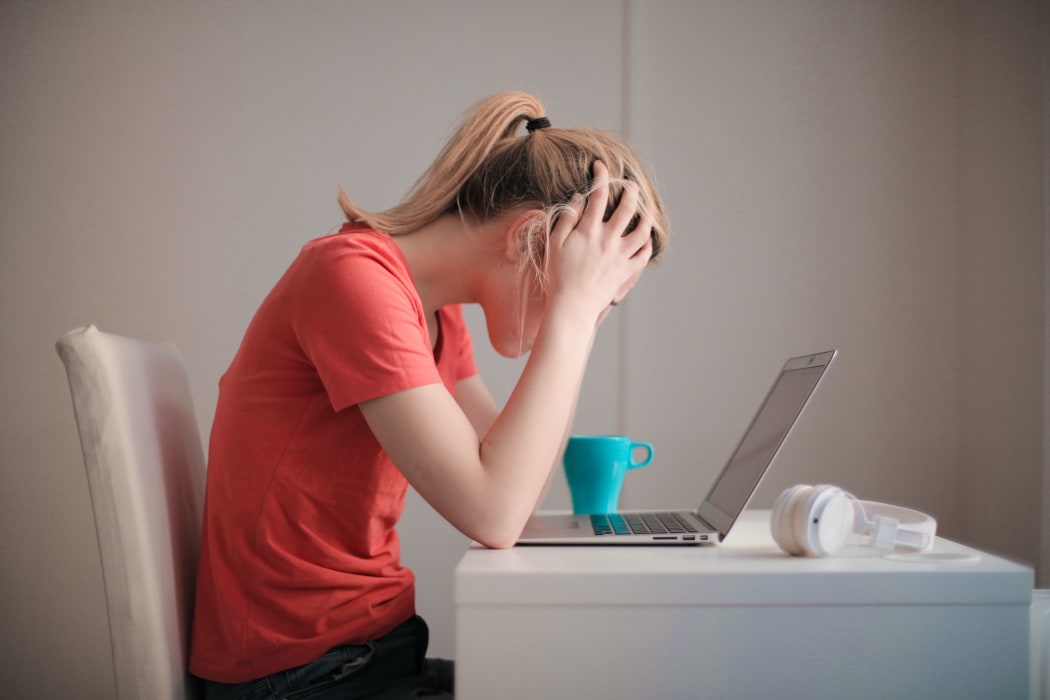 young blonde woman on laptop
