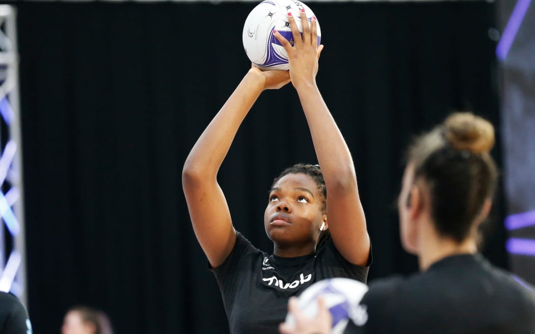 Maia Wilson looks on as Grace Nweke warms up before the Cadbury Netball Series in Palmerston North, October 2020.