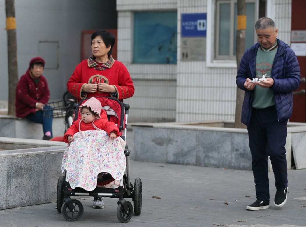 A baby is seen in Beijing, China on March 11, 2021.China considers new actions to lift flagging birthrate.( The Yomiuri Shimbun ) (Photo by Koki Kataoka / Yomiuri / The Yomiuri Shimbun via AFP)