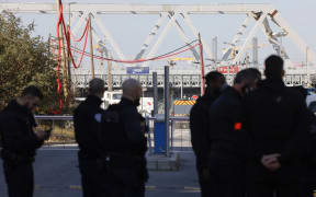 French police officers block the access to the SNCF's freight area in Saint-Denis, northern suburb of Paris on 7 March.
