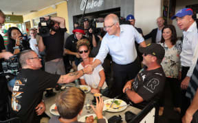 Australia's Prime Minister Scott Morrison greets supporters at an election launch rally in Brisbane.