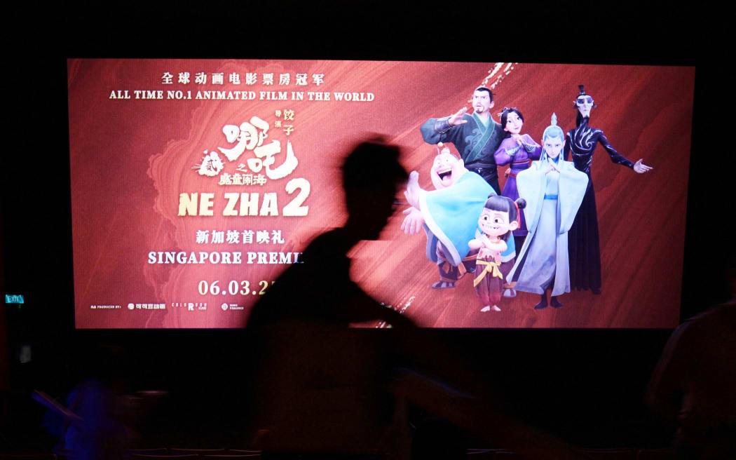 SINGAPORE, March 2, 2025 (Xinhua) -- An audience attends the premiere of the Chinese animated film "Ne Zha 2" at The Projector movie theater in Singapore, on March 2, 2025. The Chinese animated film "Ne Zha 2" will be officially released in Singapore on March 6. (Xinhua/Then Chih Wey) (Photo by Then Chih Wey / XINHUA / Xinhua via AFP)