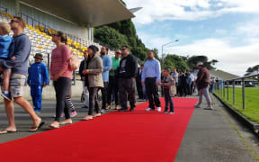 The crowds move into the newly named and blessed stadium.