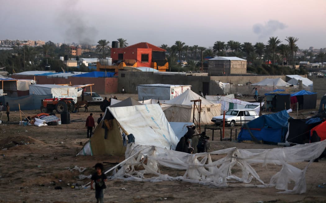 Displaced Palestinians are setting up tents on a beach near Deir el-Balah in the central Gaza Strip on May 7, 2024, amid the ongoing conflict between Israel and the Palestinian militant group Hamas.