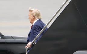Former US President Donald Trump arrives at Ronald Reagan Washington National Airport on August 3, 2023 in Arlington, Virginia. Trump is scheduled to be arraigned on four felony counts in federal court today for his alleged efforts to overturn the results of the 2020 presidential election.