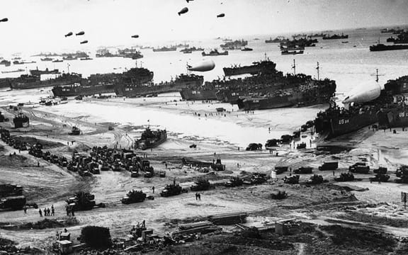 Equipment is unloaded on the beach in Normandy, France after the initial D-Day invasion on 6 June 1944.