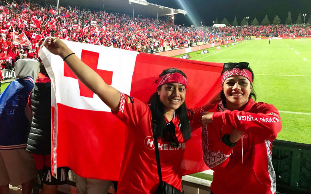 Losa Hopoi (left) celebrates a Tonga victory.