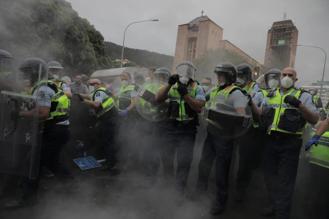 Police clash with protesters at the occupation of Parliament.