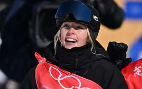 New Zealand's Zoi Sadowski Synnott waits for her score as she competes in the snowboard women's slopestyle final run during the Beijing 2022 Winter Olympic Games at the Genting Snow Park H & S Stadium in Zhangjiakou on February 6, 2022.