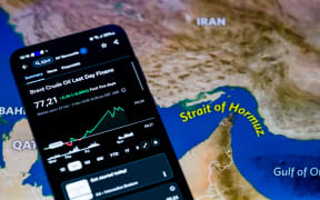 The Brent crude oil price chart from the past week is displayed on a mobile screen in this photo illustration, as prices fluctuate amid escalating conflict involving Iran and concerns over global supply disruptions in Brussels, Belgium, on March 2, 2026. (Photo by Jonathan Raa/NurPhoto) (Photo by Jonathan Raa / NurPhoto via AFP)